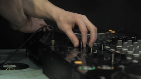 DJ mixing music at a club.