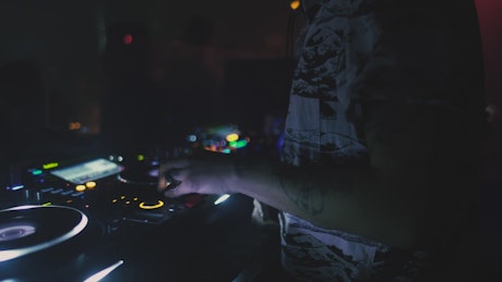 DJ playing music at a nightclub.
