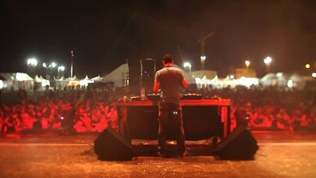 DJ playing music on stage.