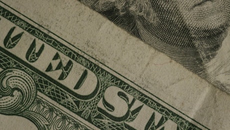 Dollar bills close up rotating