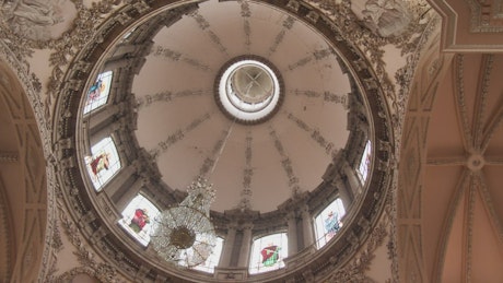 Dome inside a church with baroque details.
