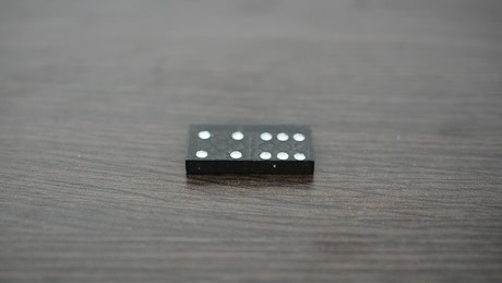 Dominoes on a table during a game