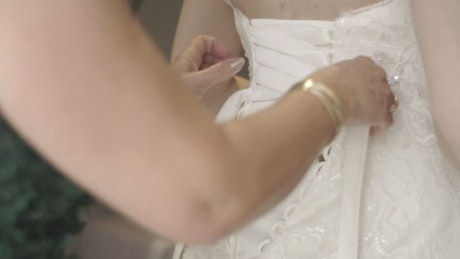 Dressing the bride.