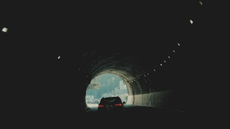 Driving in a dark tunnel.