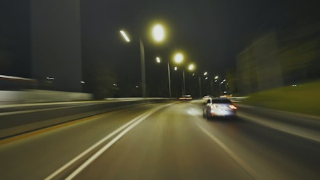 Driving through a night city.