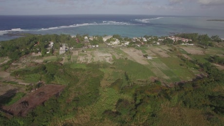 Drone flying above coastal farms