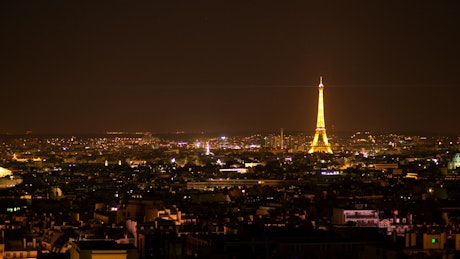 Eiffel tower illuminated at night.