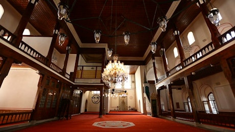 Elegant room with chandeliers inside a mosque.