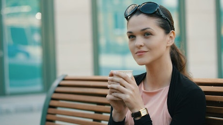 Enterprising woman drinking coffee before work.