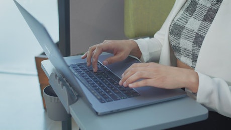 Entrepreneur woman typing on her laptop.
