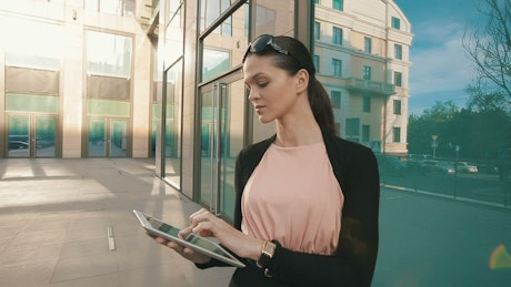 Entrepreneur works on her tablet