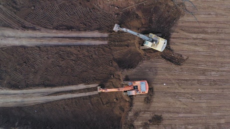 Excavators clearing a mining site.