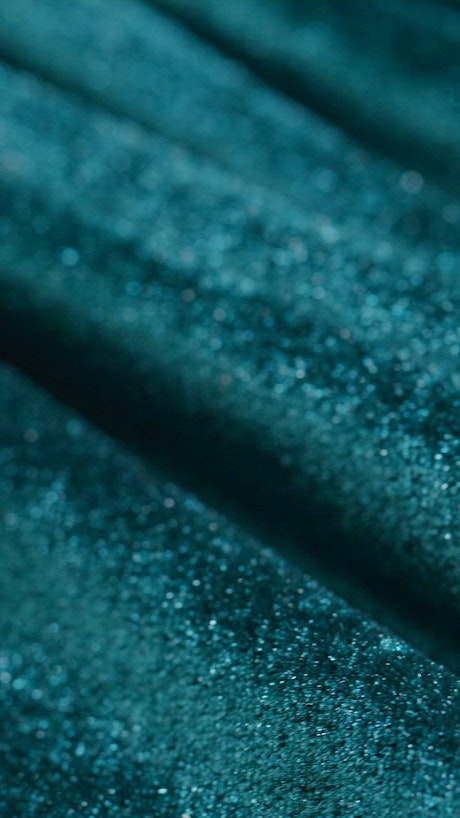 Extreme close up of the texture of a shiny fabric.