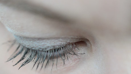 Eye of a young woman in a very close shot