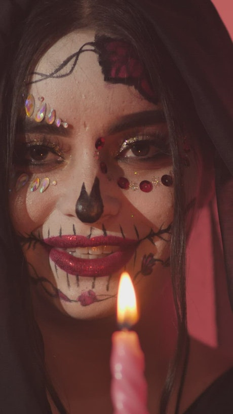 Face of a catrina from Mexico laughing maliciously.