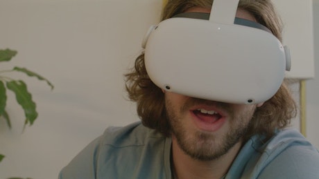 Face of a man using virtual reality glasses.