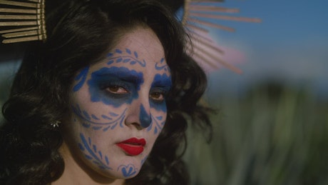 Face of a woman made up as catrina.