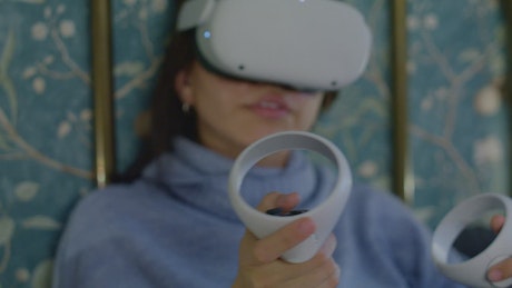 Face of a woman with virtual reality glasses.