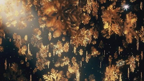 Falling golden snowflakes with black background