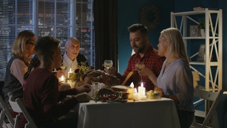 Family having thanksgiving dinner at home.