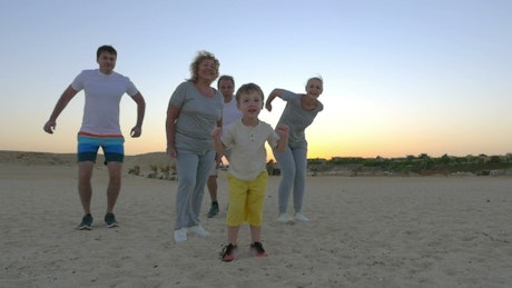 Family jumping at the beach