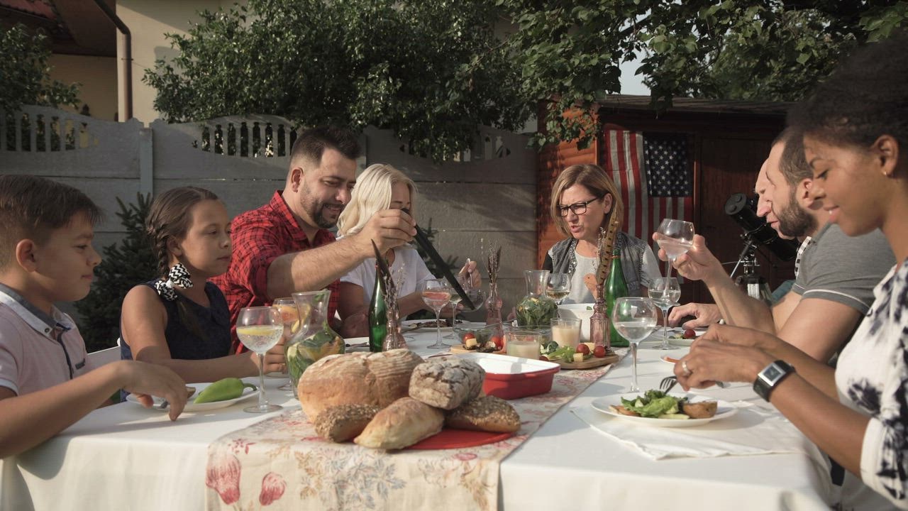 Family reunion dinner in the garden - Free Stock Video