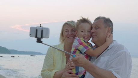 Family taking a photo with a selfie stick