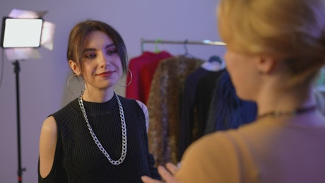 Fashion designer talking with a client.