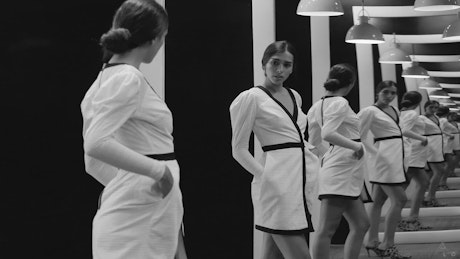 Fashion model in front of multiple mirrors
