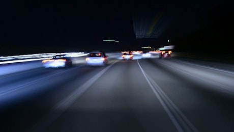 Fast driving on a highway at night.