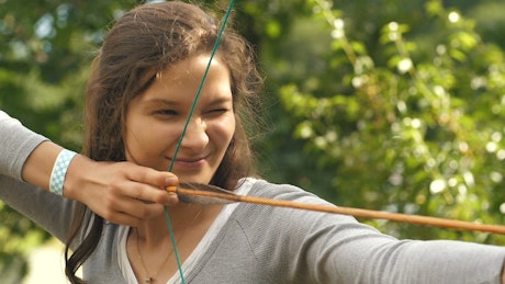 Female archer shooting an arrow