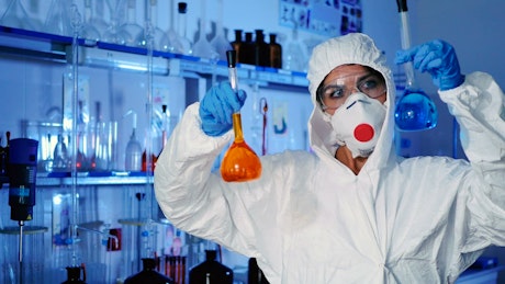 Female scientist analyzes different substances