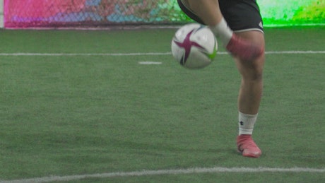 Female soccer player doing freestyle