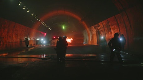 Firefighters to the rescue inside a dark tunnel.