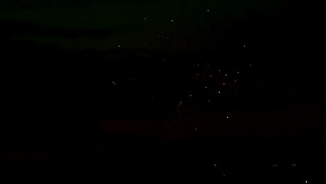 Fireworks flashing colors in the night sky