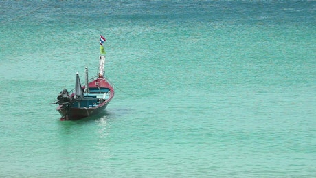 Fishing boat at the sea during the day.