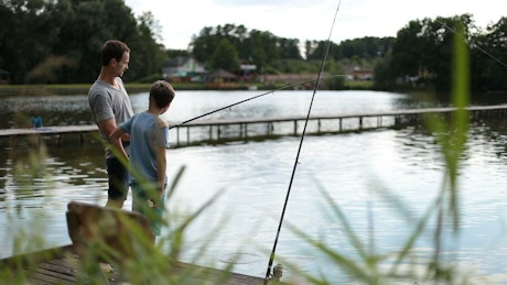 Fishing together by the lake.