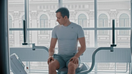Fitness man training at a modern gym