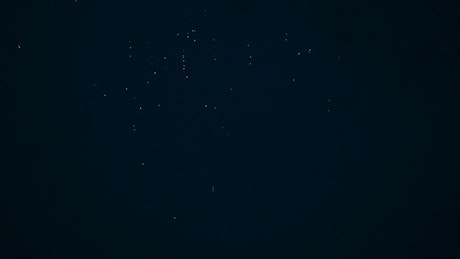 Flashing fireworks in the night sky