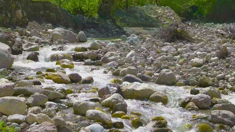 Flowing water between rocks in a stream.
