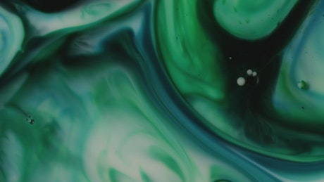 Fluid green shapes in motion.