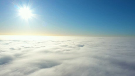 Flying above the clouds on a clear day
