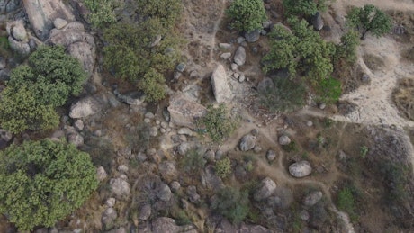 Flying over a rocky and arid relief.