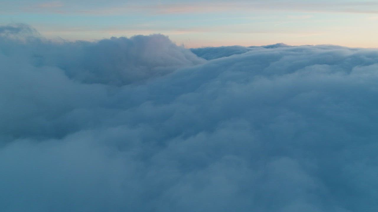 Download Flying over a thick layer of clouds in the sky - Free ...
