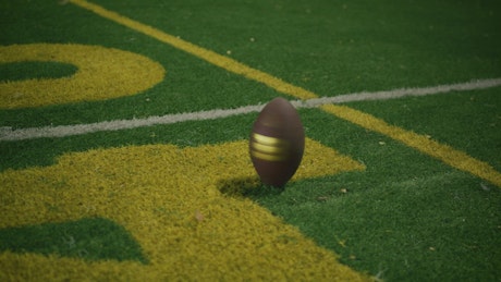 Football ball spinning to a stop