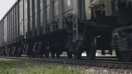 Freight train running across tracks.