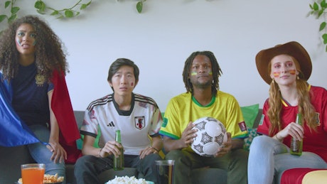 Friends from different nations watching the world cup.