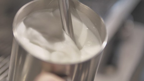 Frothing milk seen in detail.