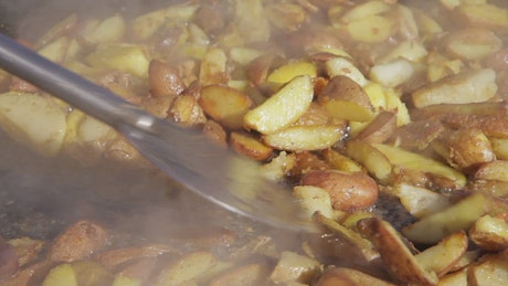 Frying potatoes on a pan