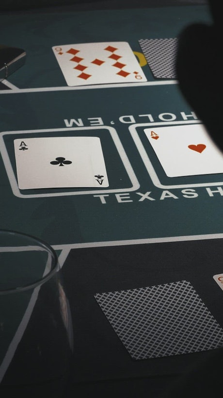 Game table with poker cards and chips